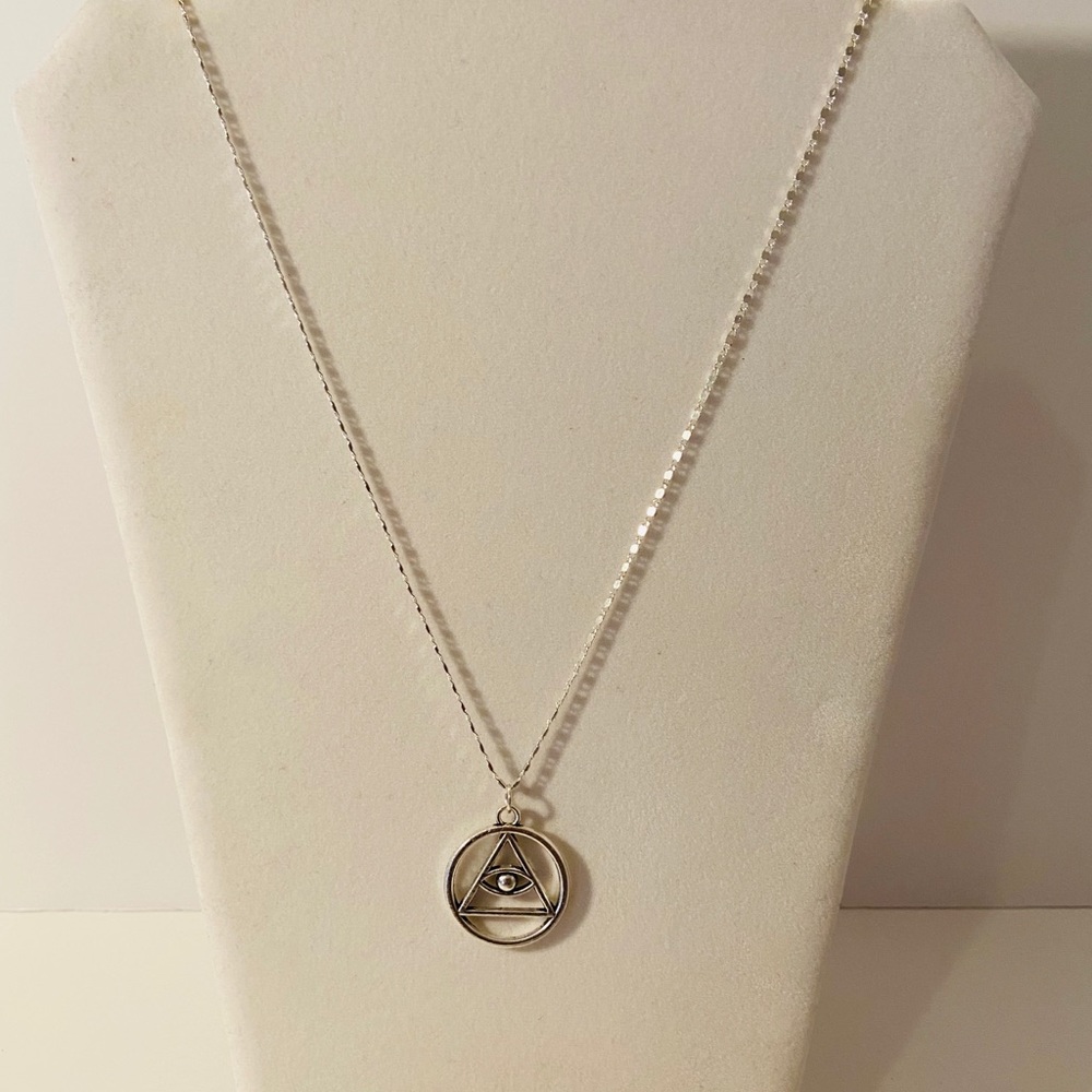 Silver plated Hasma evil eye necklace.